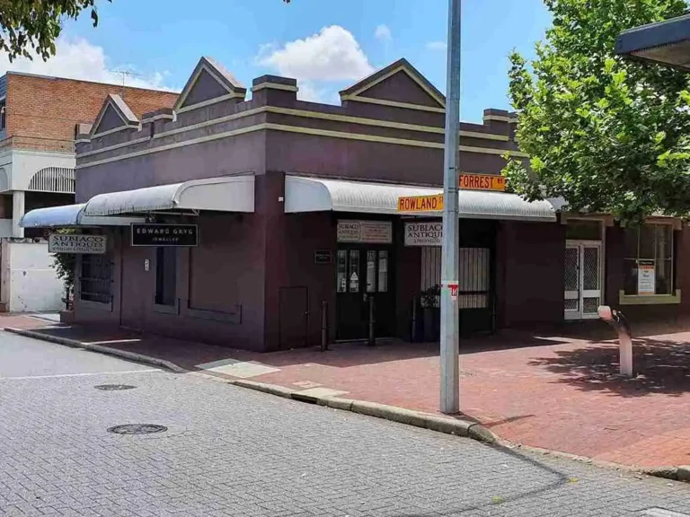Street view of a single-story brick commercial storefront