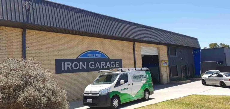Commercial warehouse facility exterior with service van parked outside