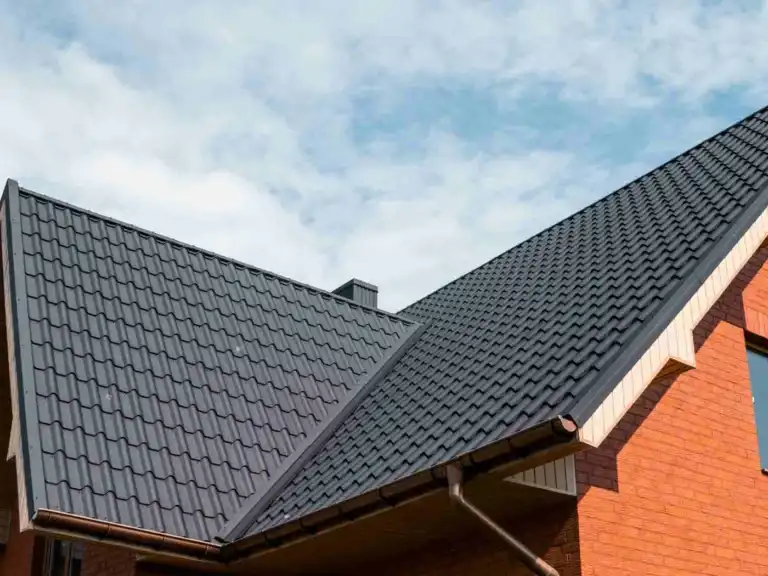 Close-up of modern dark grey roof tiles on a residential home