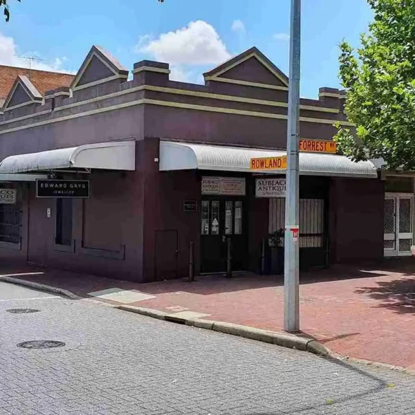 Street view of a single-story brick commercial storefront