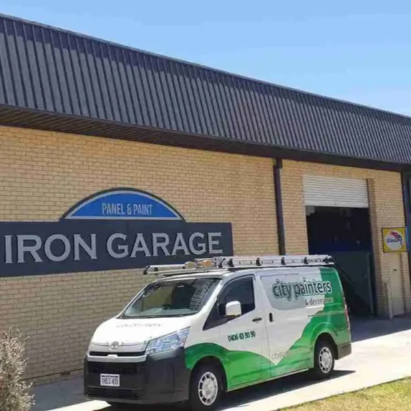Commercial warehouse facility exterior with service van parked outside