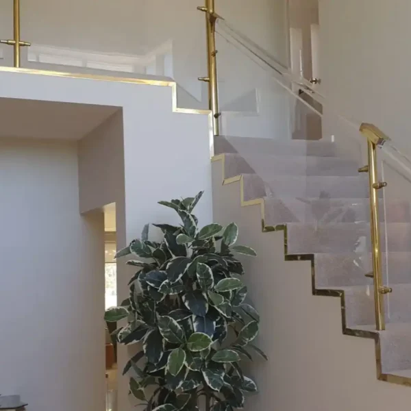 Interior view of a home entrance foyer with a staircase and light walls