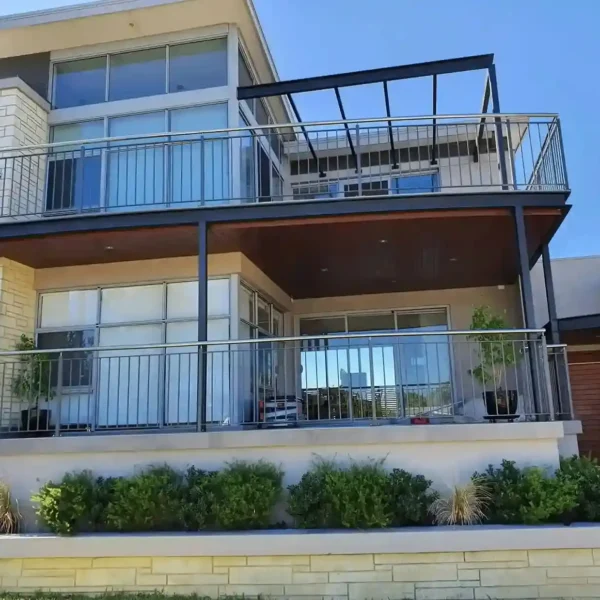 Exterior view of a modern two-story residential house with balcony